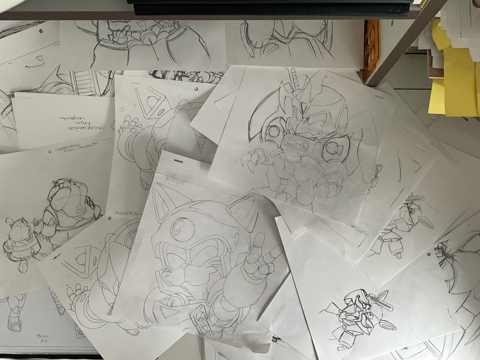 Pencil concept drawings spread across a desk